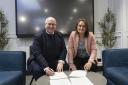 Carlisle United chief executive Nigel Clibbens and Professor Julie Mennell signing the memorandum