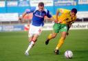 Richard Keogh, left, in typically forceful running action for Carlisle