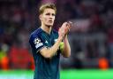 Arsenal’s Martin Odegaard applauds the fans at the end of the Champions League quarter-final defeat to Bayern Munich. (Nick Potts/PA)