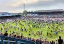 Scenes from May's pitch invasion