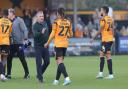 Paul Simpson shakes hands with Cambridge's ex-Blues striker JK Gordon after the game