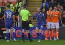 Joe Garner protests to the referee at Blackpool