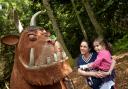 Claire Steel and Savannah Carruthers look at Forestry England's statue on its Gruffalo Trail