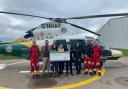 The trainees present the check to GNAAS