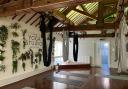 The fabric was hung from the wooden beams in Carlisle Yoga Studio