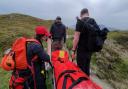 Coniston Mountain Rescue team and fellow walkers stretcher the man down Blag Crag