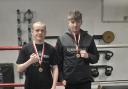 Logan Orr and Maani Campbell with their gold medals from the Denmark tournament