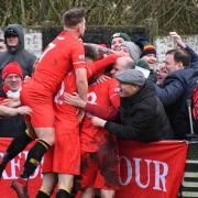 JOYOUS SCENES: Reds players celebrate Brad Carroll’s second goal with their fans at Kendal                        Ben Challis