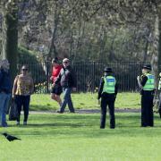 Police officers chat to park users in Glasgow Green to ensure members of the public are following lockdown guidelines as the UK continues in lockdown to help curb the spread of the coronavirus.