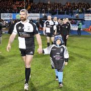 Kyle Amor leads out Cumbria RL  PIC: Ben  Challis Sports Photography