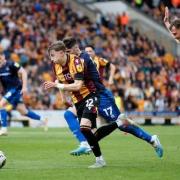 Scott Banks on the attack for Bradford in the first leg against Carlisle