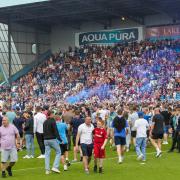 Scenes from the pitch invasion after the Bradford play-off game
