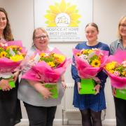 Hospice at Home West Cumbria staff were gifted bouquets along with the donation