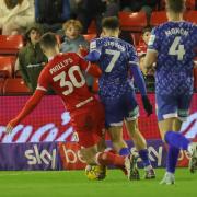 Jordan Gibson was penalised for his challenge on Adam Phillips as Barnsley won a decisive late penalty