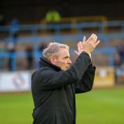 Paul Simpson applauds United's fans after the game