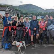 L to R: Peter Wyatt, Alex Bowness, animal care assistant, Margaret McCall, Eden Animal Rescue office administrator, Vicki Broughton, animal care manager, Chris Bowness, Sarah Harrison-Wyatt with Cuillin the dog after completing the Ullswater