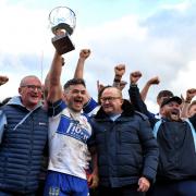 Matty Henson lifts the Ike Southward Trophy for Workington Town after their derby clash with Whitehaven	             Ben Challis Sport Photography