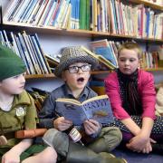 Wiggonby C of E School celebrating World Book Day, six-year-old Jude Todhunter as Roald Dahl's Fantastic Mr Fox, reading his book to, from left, Bailey Thwaites, aged five, Rory Thomlinson, aged nine, and Molly Jagger, aged five, 3 March 2016  LOUISE