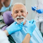 Who is eligible for free dental care in England?