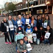 Adrienne Gill and her eight-year-old son Kieran, with members of the Carlisle Autism Parents Support Group, who are walking around the city to raise the awareness of autism,