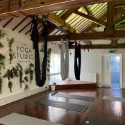 The fabric was hung from the wooden beams in Carlisle Yoga Studio