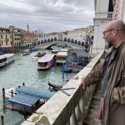 Daniel on the balcony of the gallery overlooking the Grand Canal and Rialto bridge