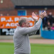 Paul Simpson applauds fans at the end of the game