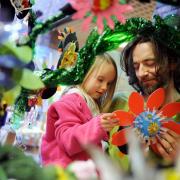Artist Julian Longcake and daughter Tilia, five, put the finishing touches to a 'Recycle Tree' at Tullie House