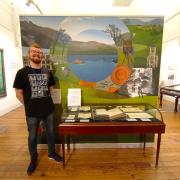 Sam Turnbull with his dedicated volunteer case at Keswick Museum