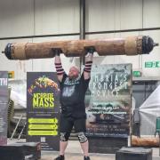 James Heald lifts the 155kg log, making it the heaviest log press in Cumbria