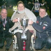 All smiles: Comets’ management trio with the league title (Picture: Dave Payne)