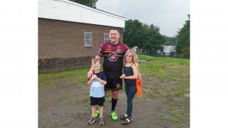 Archie Routledge with his dad Mark and older sister Halle