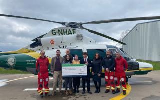 The trainees present the check to GNAAS