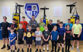Marc Haughan, back row fourth from left, brought his title belt (front) back to Carlisle Villa ABC this week after his national senior elite championships victory