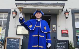 Brian Pease in his new coat and hat outside the Howard Arms Hotel