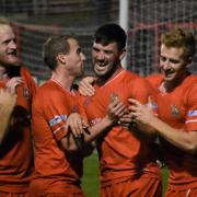 Get in: Reds celebrate Charlie Bowman's first goal in their win over Kendal Town (Photos: Ben Challis)