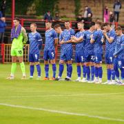 Carlisle players line up for the minute's applause