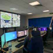 Andy Petty (right) and a member of police staff looking at the CCTV monitors across the county. Many of these cameras are now in HD.