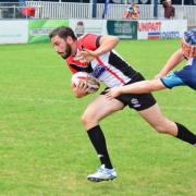 Two tries to his name: Gordon Maudling beats the Coventry Bears full-back to score