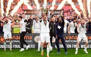 Bromley's captain, ex-Carlisle defender Byron Webster, lifts the play-off winners' trophy at Wembley