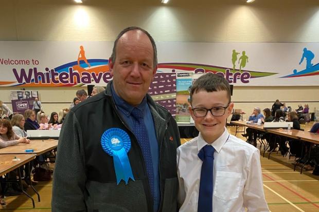 HELPING HAND: Councillor Andy Pratt and son Sam at the Copeland election count