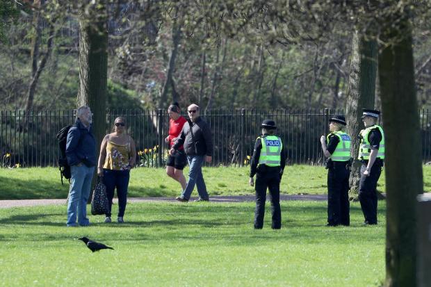 Police officers chat to park users in Glasgow Green to ensure members of the public are following lockdown guidelines as the UK continues in lockdown to help curb the spread of the coronavirus.