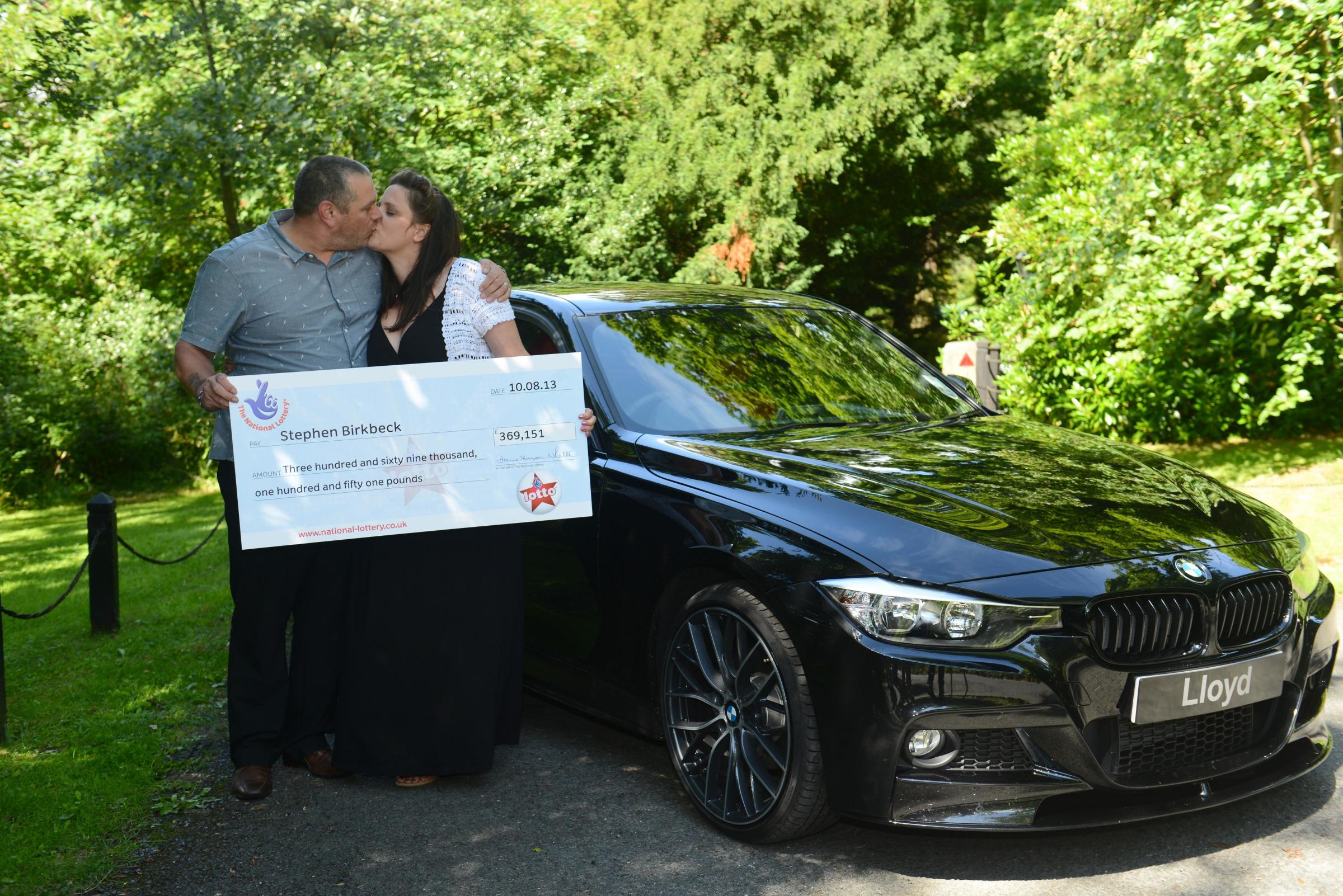 Stephen and Tracy Birkbeck from Penrith, Cumbria, toast their £369,151 Lotto win at Ullswater in the Lake District. The lucky couple put their fortune down to a scarab beetle they had recently purchased on a holiday to Egypt. Their numbers came up