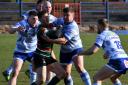 Workington Town v West Bowling. Town pile in for a tackle. Picture: Ben Challis