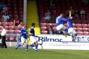 Celebration: Trevor Molloy, far right, and Blues team-mates show their joy after his penalty at Lincoln