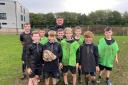 COACHING: Workington Town captain Jamie Doran with Workington Academy pupils who have been learning the fundamentals of rugby league