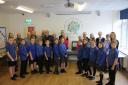 TOGETHER: Class 4 pupils welcome former Orton CofE pupils back to the school