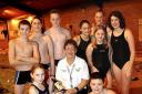 20031106    Eleanor Walsh Presentation
Founder of the Cockermouth Swimming Club,coach Eleanor Walsh was presented with gifts,when the club celebrated its 25th anniversary,seen here is Eleanor, with some of her swimmers.
Pic Stan Partleton         Copy