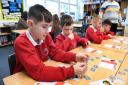 Children learning about personal finance at Brampton Primary School as part of the Vault programme.