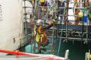 Divers enter nuclear pool for first time in 65 years